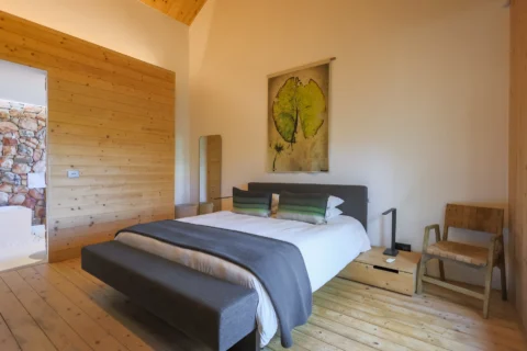 Apple Grove: double bedroom with a lily-pad print above the bed and pine-clad walls, Old Mac Daddy, Elgin Valley