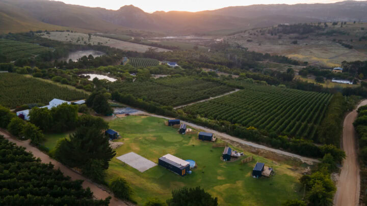 Klein Paradys: aerial view of the units among orchards with mountains at sunset, Old Mac Daddy, Elgin Valley