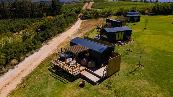 Klein Paradys: aerial view of units with decks and hot tubs along a gravel road, Old Mac Daddy, Elgin Valley