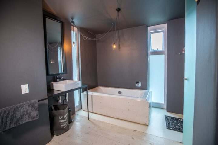 Villa bathroom with a freestanding bath and a basin on a black stand, Old Mac Daddy, Elgin Valley